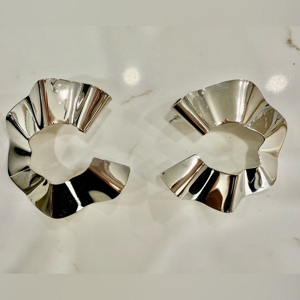 Silver toned large hoop earrings